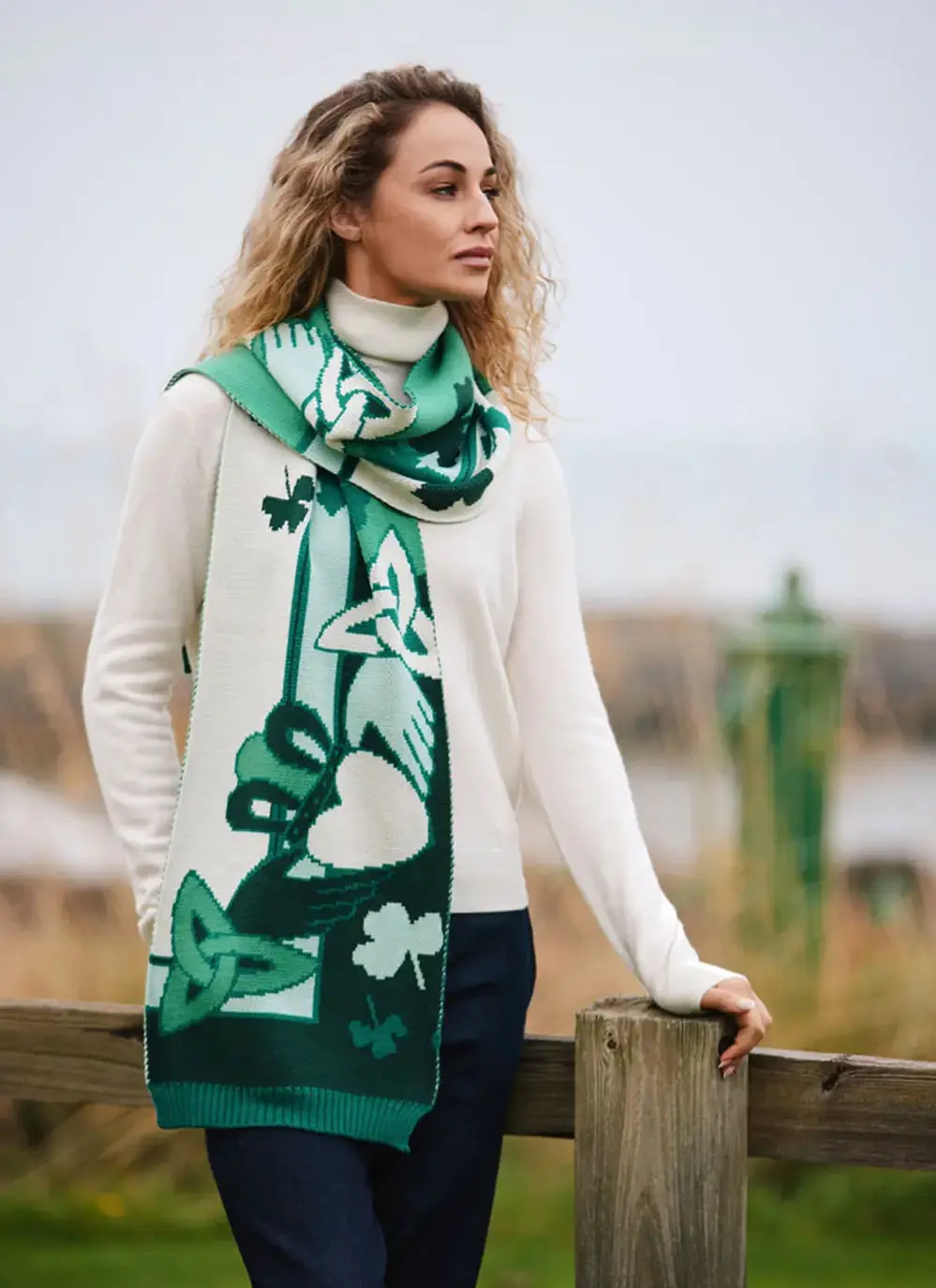 Woman wearing green and cream claddagh and trinity knot patrick francis scarf 